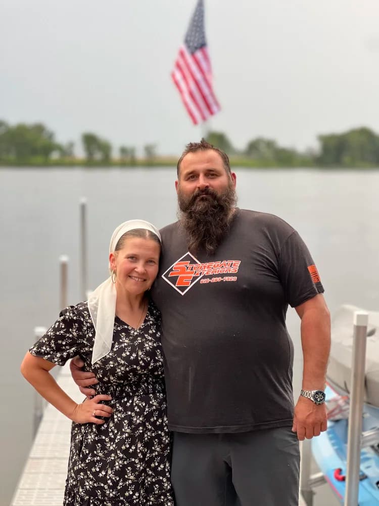 Alex Kutsev, owner of Stonegate Exteriors, with his wife